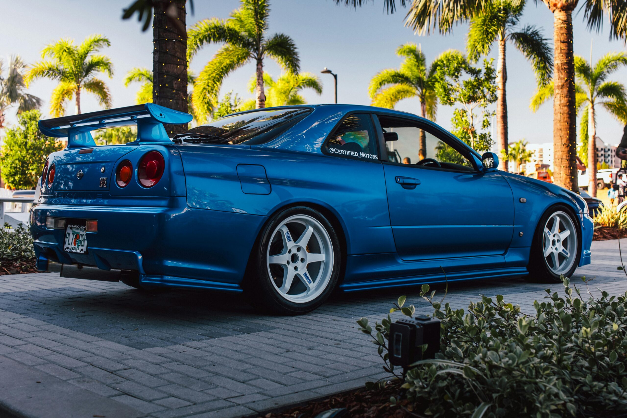 Stunning blue Nissan GT-R R34 showcased at a car event in Tampa, Florida.