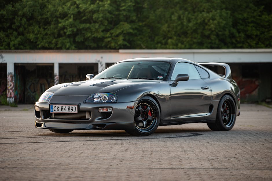 A stylish Toyota Supra supercar parked outdoors in Næstved, Denmark, showcasing its sleek design.