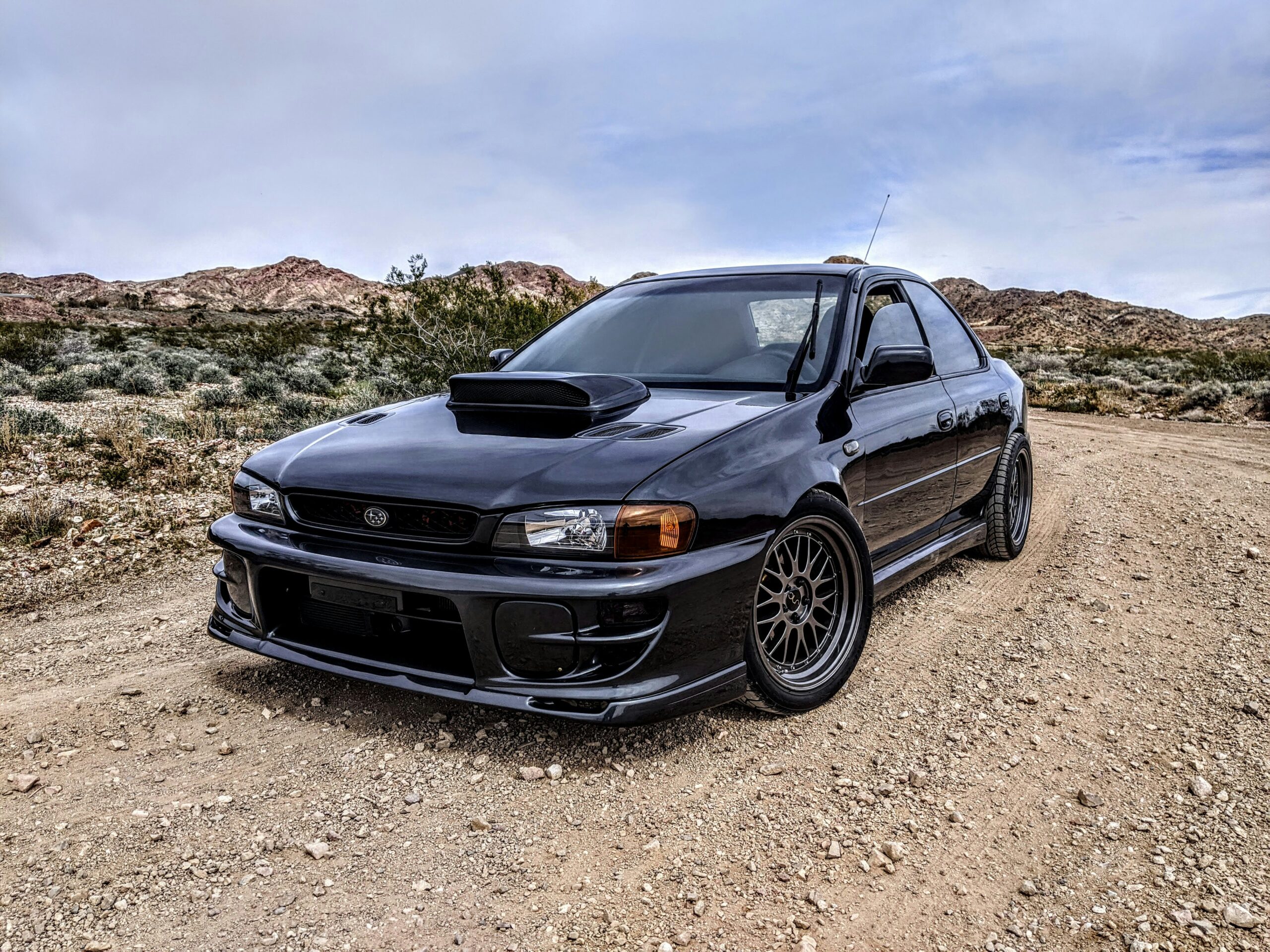 Black Subaru WRX on brown dirt road during daytime  By RyKing Uploads
