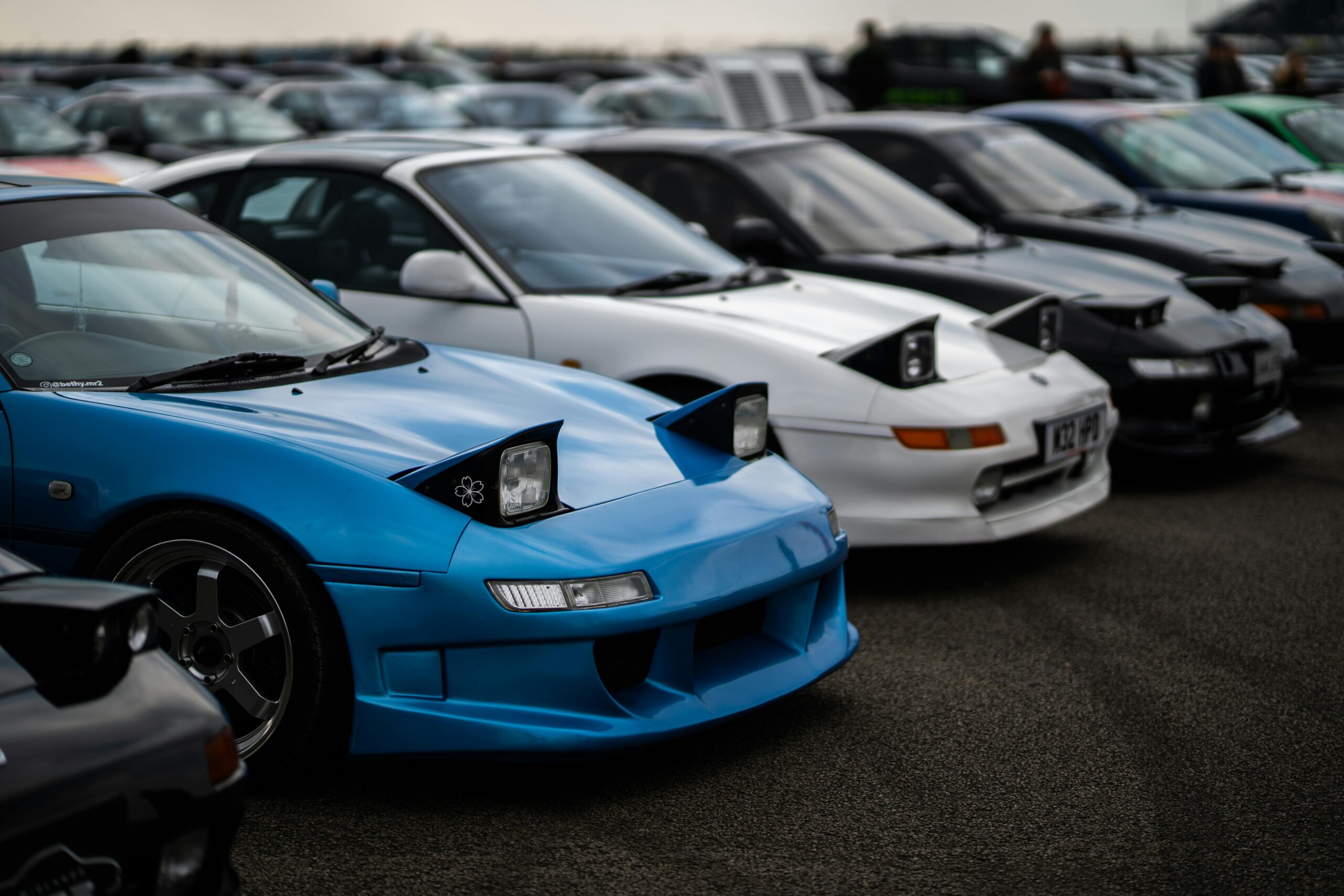 Toyota MR2 sports cars with popup headlights showcased at a car meet in England.  By Jagjeet Dhuna