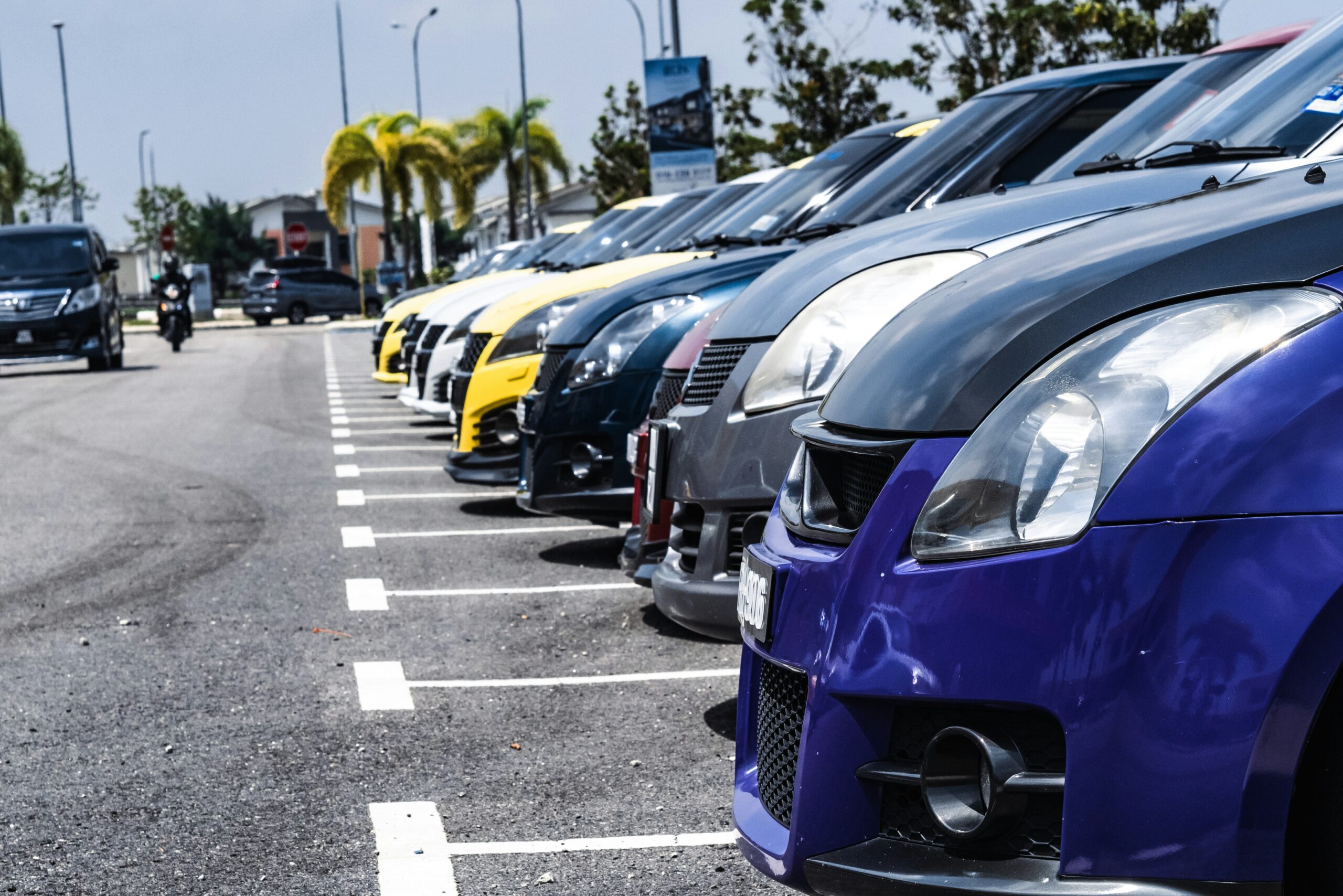 a row of cars parked in a parking lot